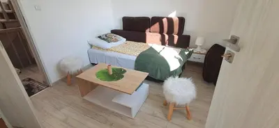 Łóżko lub łóżka w pokoju w obiekcie Ognik Pokoje