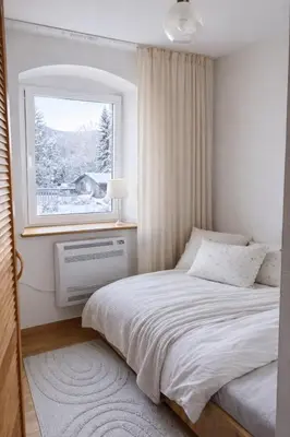 Łóżko lub łóżka w pokoju w obiekcie Apartament z kominkiem