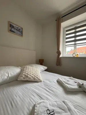 Łóżko lub łóżka w pokoju w obiekcie Apartamenty Werona w Rynku