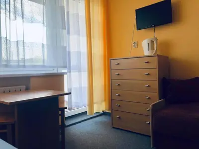 Telewizja i/lub zestaw kina domowego w obiekcie Pokoje przy Morzu