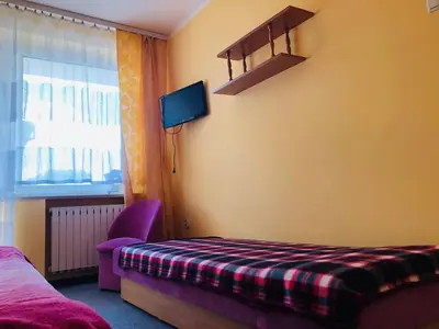 Łóżko lub łóżka w pokoju w obiekcie Pokoje przy Morzu