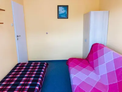 Łóżko lub łóżka w pokoju w obiekcie Pokoje przy Morzu