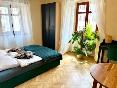 Łóżko lub łóżka w pokoju w obiekcie Apartamenty Katedralna Legnica