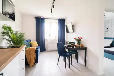 Telewizja i/lub zestaw kina domowego w obiekcie Apartamenty Katedralna Legnica