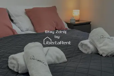 Łóżko lub łóżka w pokoju w obiekcie StayZdrój by LibertaRent