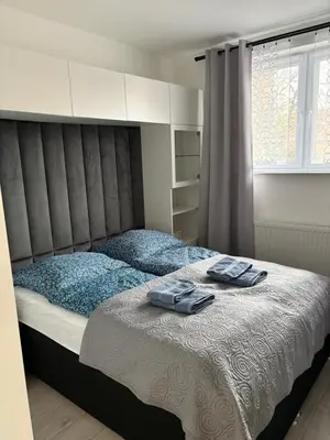 Łóżko lub łóżka w pokoju w obiekcie Apartament Olesno Lux