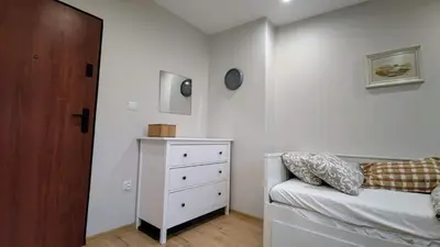 Łóżko lub łóżka w pokoju w obiekcie Apartament Wysoka 580 z prywatną łazienką