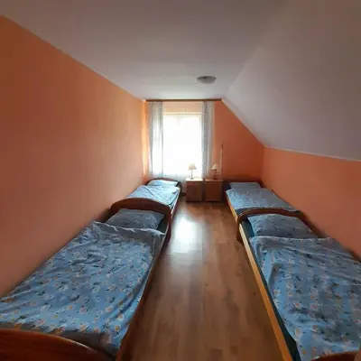 Łóżko lub łóżka w pokoju w obiekcie Górska Perła Pokoje Gościnne