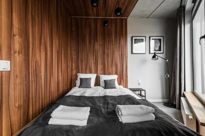 Łóżko lub łóżka w pokoju w obiekcie RentPlanet - Studio Legnicka