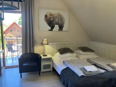Łóżko lub łóżka w pokoju w obiekcie POKOJE GOŚCINNE Złote Modrzewie