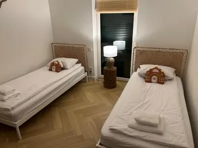 Łóżko lub łóżka w pokoju w obiekcie Domek Las&Luz Moszna BALIA