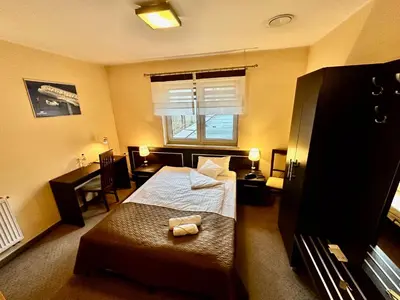 Łóżko lub łóżka w pokoju w obiekcie Hotel Pod Dębami