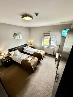 Łóżko lub łóżka w pokoju w obiekcie Hotel Pod Dębami