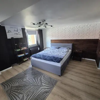 Łóżko lub łóżka w pokoju w obiekcie Sowi Przystanek