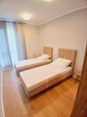 Łóżko lub łóżka w pokoju w obiekcie Słoneczny Apartament
