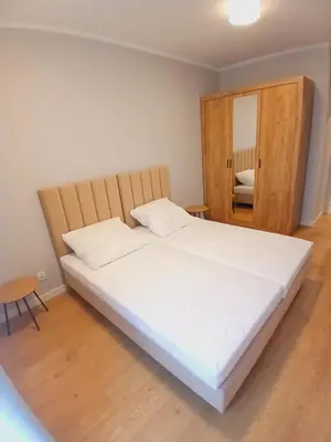 Łóżko lub łóżka w pokoju w obiekcie Słoneczny Apartament