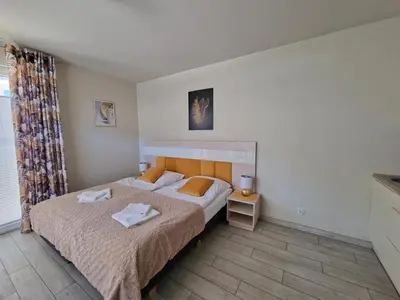 Łóżko lub łóżka w pokoju w obiekcie Czarna Góra Apartament ISCHGL 20