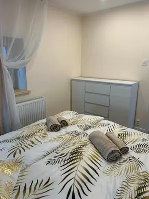 Łóżko lub łóżka w pokoju w obiekcie Apartament Gold - Góry Sowie - Głuszyca