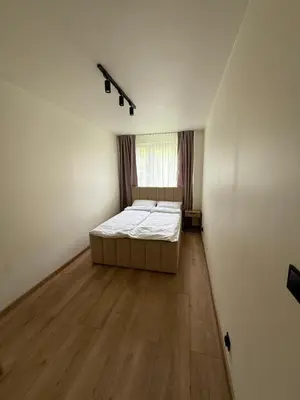 Łóżko lub łóżka w pokoju w obiekcie Apartament Grodzka
