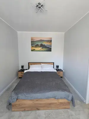 Łóżko lub łóżka w pokoju w obiekcie Bike Center 2 Apartament