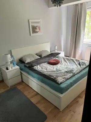 Łóżko lub łóżka w pokoju w obiekcie Wrocław Manganowa