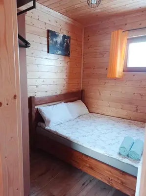 Łóżko lub łóżka w pokoju w obiekcie Pod Niedźwiedzicą
