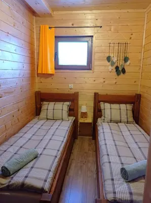 Łóżko lub łóżka w pokoju w obiekcie Pod Niedźwiedzicą