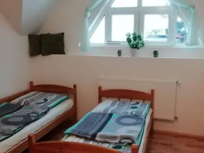 Łóżko lub łóżka w pokoju w obiekcie Agroturystyka Sielskie Góry