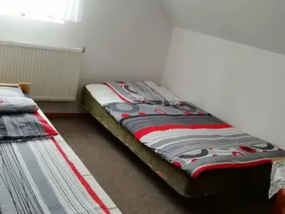 Łóżko lub łóżka w pokoju w obiekcie Agroturystyka Sielskie Góry