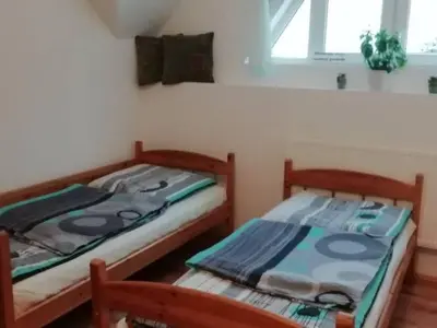Łóżko lub łóżka w pokoju w obiekcie Agroturystyka Sielskie Góry