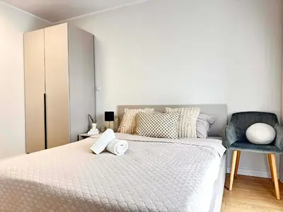 Łóżko lub łóżka w pokoju w obiekcie Oro Apartments Centrum Wrocław