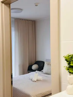 Łóżko lub łóżka w pokoju w obiekcie Oro Apartments Centrum Wrocław