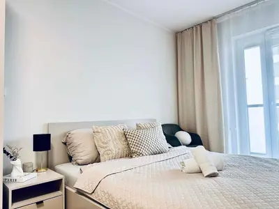 Łóżko lub łóżka w pokoju w obiekcie Oro Apartments Centrum Wrocław