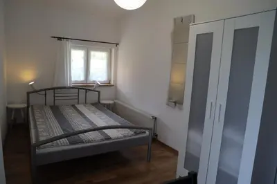 Łóżko lub łóżka w pokoju w obiekcie Stara Szkoła w Romanowie