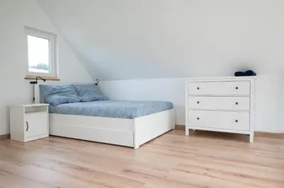 Łóżko lub łóżka w pokoju w obiekcie Ptasi Śpiew