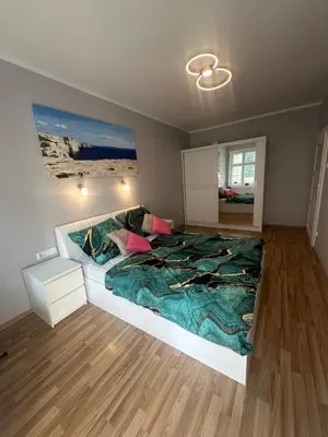 Łóżko lub łóżka w pokoju w obiekcie Chrobrego 10