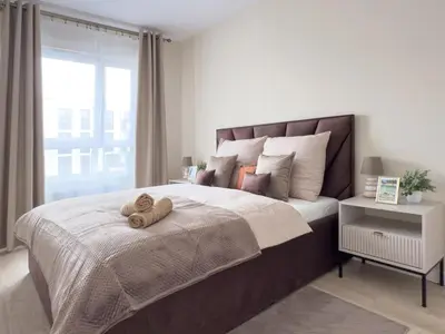 Łóżko lub łóżka w pokoju w obiekcie Waterloo Apartment