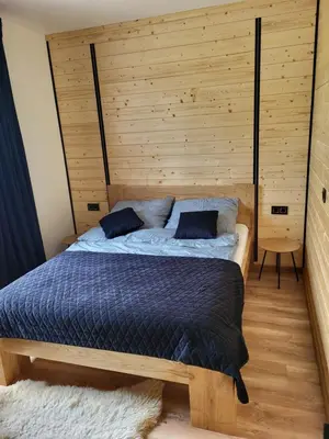Łóżko lub łóżka w pokoju w obiekcie Apartament Różane Wzgórze