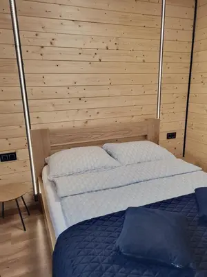 Łóżko lub łóżka w pokoju w obiekcie Apartament Różane Wzgórze