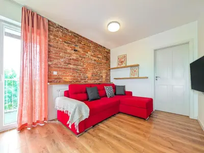 Telewizja i/lub zestaw kina domowego w obiekcie Reymonta Vivid Space Apartment by BookingHost