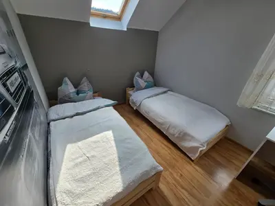 Łóżko lub łóżka w pokoju w obiekcie Willa na Ogrodowej