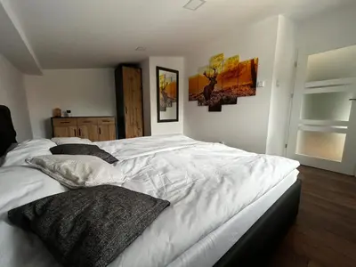 Łóżko lub łóżka w pokoju w obiekcie Loft Apartments Bielawa 