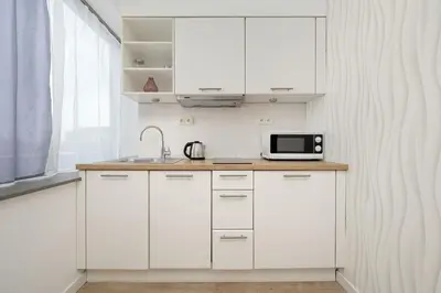 Kuchnia lub aneks kuchenny w obiekcie Bright Studio with Air Conditioning and Parking by Noclegi Renters