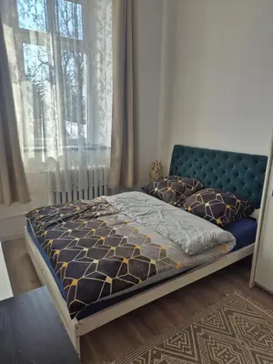 Łóżko lub łóżka w pokoju w obiekcie Apartament Kościelna