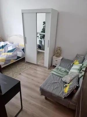 Łóżko lub łóżka w pokoju w obiekcie Apartament Kościelna