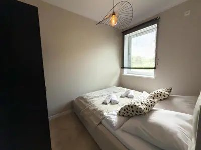 Łóżko lub łóżka w pokoju w obiekcie Apartamenty przy Dworcu by LibertaRent