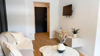 Telewizja i/lub zestaw kina domowego w obiekcie Apartamenty przy Dworcu by LibertaRent