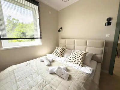 Łóżko lub łóżka w pokoju w obiekcie Apartamenty przy Dworcu by LibertaRent