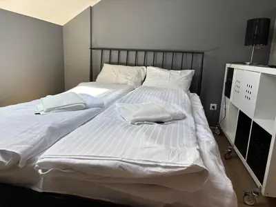 Łóżko lub łóżka w pokoju w obiekcie Mińska Apartment