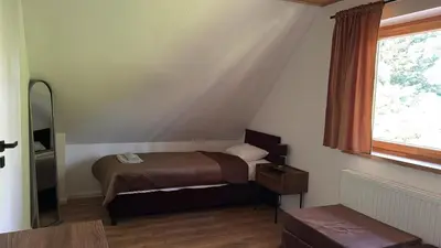 Łóżko lub łóżka w pokoju w obiekcie Stawowy Zakątek